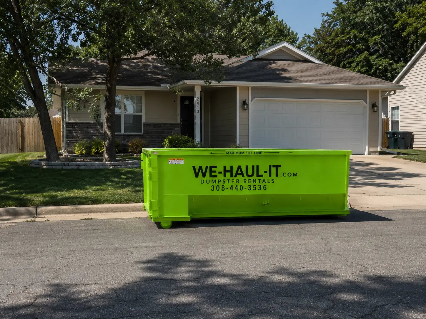 WE-HAUL-IT 15 yard residential roll-off dumpster delivered to a Gibbon NE home driveway