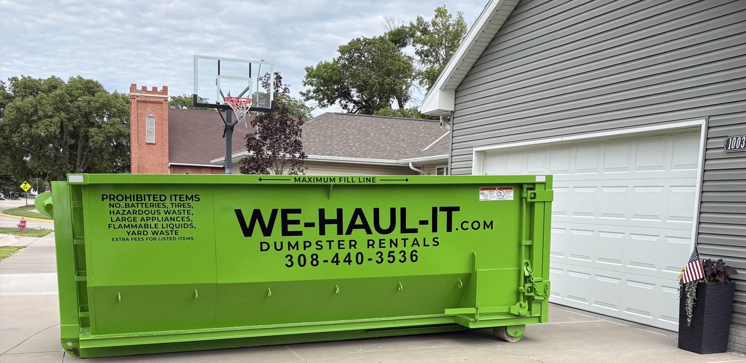 WE-HAUL-IT 15 yard residential roll-off dumpster delivered to a Gibbon NE home driveway